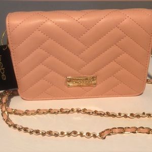New! bebe Leather Peach Pocket Book & Leather intertwined w/the Gold Chain Strap